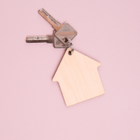 House keys attached to a wooden house keychain