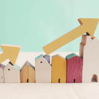 wooden houses with arrows going up