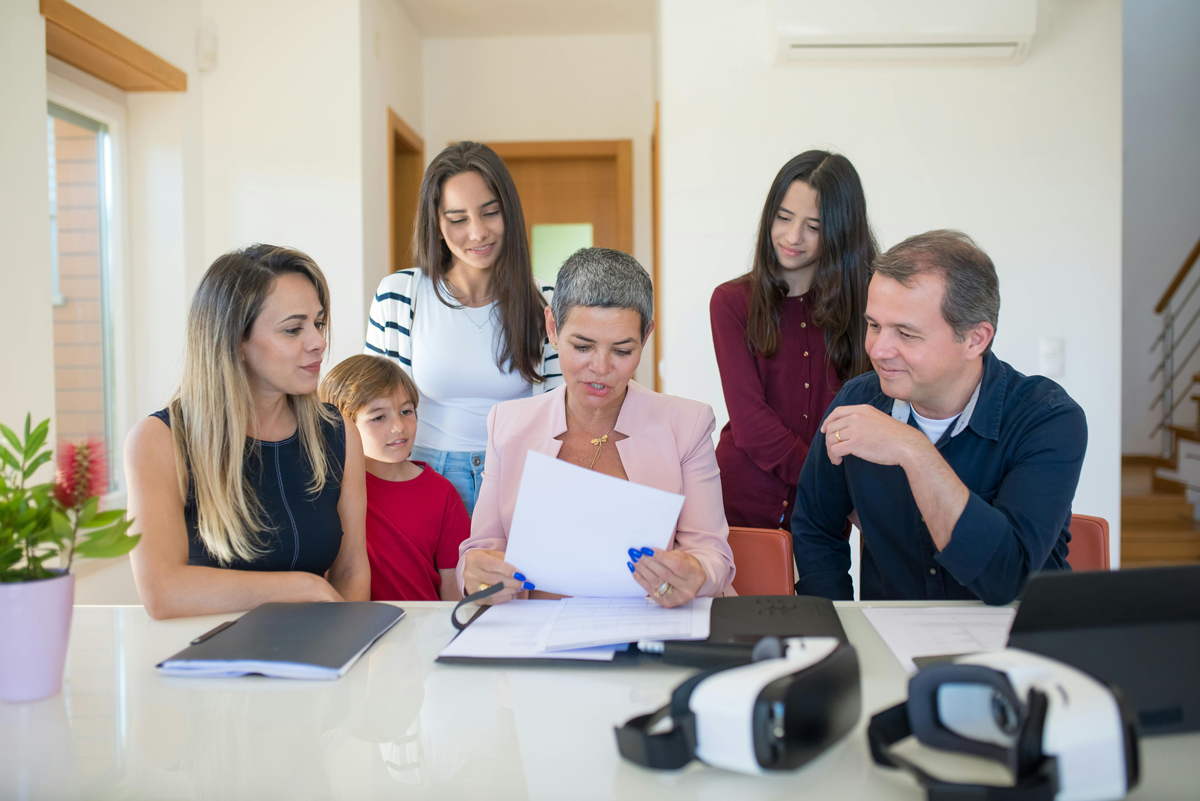 Appleton Real Estate Agent sitting with clients at a table