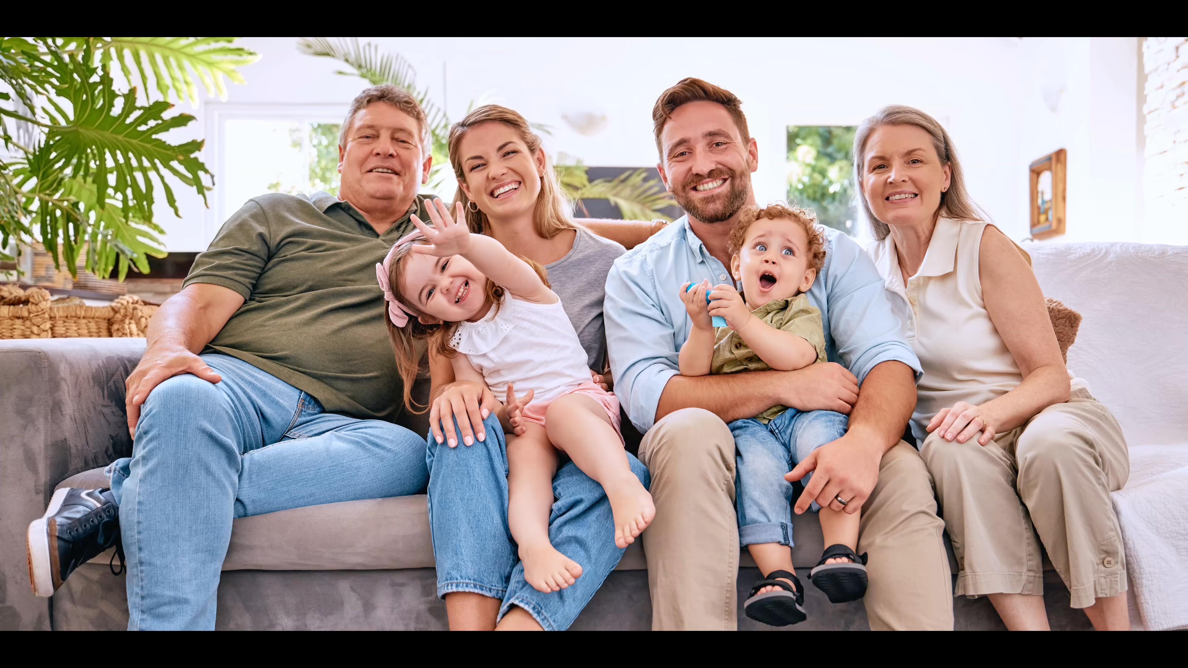 Multi generational family sitting on couch in Appleton, Wisconsin