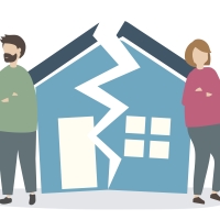 Couple with a divided house between them